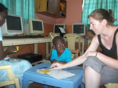 Volunteer with deaf child